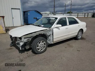 2000 Mazda 626 LX z VIN 1YVGF22C3Y5165341, wystawiony jako Copart lot #56575075 z przebiegiem 58 645 mil mil oraz Szkody całkowita. Historia ofert i sprzedaży dostępna na DreamBid. Obrazek 1.