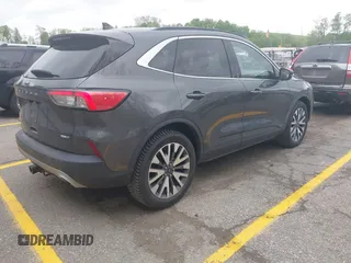 2020 Ford Escape Titanium with VIN 1FMCU9J96LUA00564, listed as a IAAI auction lot 42261152 with 73,748 mi miles and . Bid and sale history available at DreamBid. Image 4.