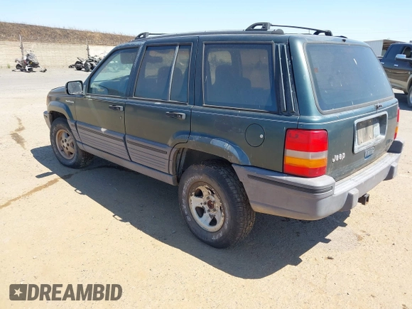 1994 Jeep Grand Cherokee Laredo with VIN 1J4GZ58S2RC118502, listed as a IAAI auction lot 42701778 with 420,559 mi miles and . Bid and sale history available at DreamBid. Image 3.