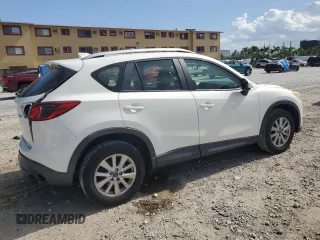2014 Mazda CX-5 Sport with VIN JM3KE2BE9E0344990, listed as a Copart auction lot 59014145 with 126,905 mi miles and Salvage title. Bid and sale history available at DreamBid. Image 3.