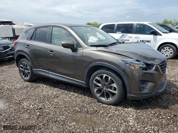 2016 Mazda CX-5 Grand Touring with VIN JM3KE2DY3G0863964, listed as a Copart auction lot 50790985 with 62,766 mi miles and Salvage Title. Bid and sale history available at carsss.com. Image 4.