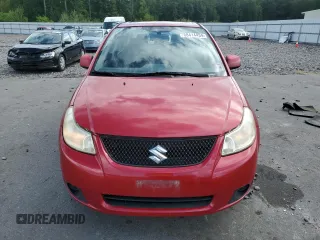2012 Suzuki SX4 LE with VIN JS2YC5A34C6300079, listed as a Copart auction lot 68414434 with 111,661 mi miles and Salvage Title. Bid and sale history available at carsss.com. Image 5.