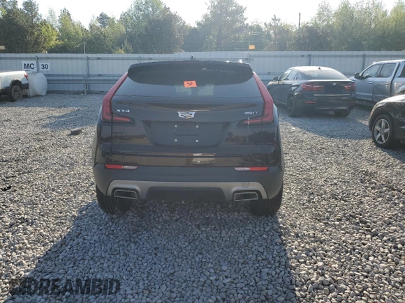 2021 Cadillac XT4 FWD Premium Luxury z VIN 1GYFZCR45MF002654, wystawiony jako Copart lot #52288105 z przebiegiem Nie podano mil oraz Szkody całkowita. Historia ofert i sprzedaży dostępna na DreamBid. Obrazek 6.