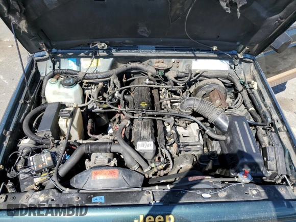 1993 Jeep Cherokee Country with VIN 1J4FJ78S4PL517648, listed as a Copart auction lot 72383564 with 127,156 mi miles and Salvage Title. Bid and sale history available at carsss.com. Image 12.