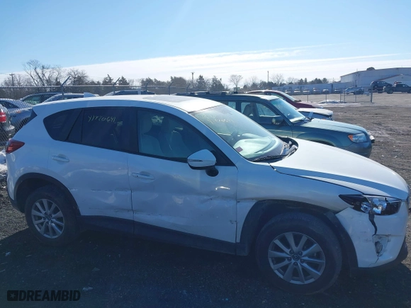 2016 Mazda CX-5 Touring with VIN JM3KE4CYXG0917841, listed as a IAAI auction lot 41420641 with 75,710 mi miles. Bid and sale history available at carsss.com. Image 13.