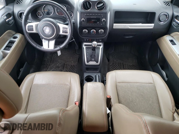 2016 Jeep Compass High Altitude Edition with VIN 1C4NJCEA0GD769610, listed as a Copart auction lot 52746435 with 136,849 mi miles and Salvage Title. Bid and sale history available at carsss.com. Image 8.