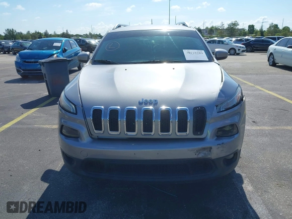 2014 Jeep Cherokee Latitude with VIN 1C4PJLCS6EW103423, listed as a IAAI auction lot 40118289 with 112,120 mi miles and . Bid and sale history available at DreamBid. Image 12.