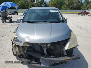 2009 Nissan Versa S with VIN 3N1BC11EX9L444814, listed as a Copart auction lot 59732395 with 188,471 mi miles and Salvage title. Bid and sale history available at DreamBid. Image 5.