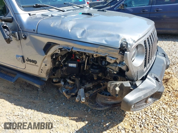 2021 Jeep Gladiator Willys z VIN 1C6HJTAG6ML507039, wystawiony jako IAAI lot #42057637 z przebiegiem 69 443 mil mil oraz . Historia ofert i sprzedaży dostępna na DreamBid. Obrazek 6.