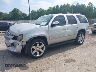 2012 Chevrolet Tahoe LT with VIN 1GNSKBE03CR124911, listed as a IAAI auction lot 40066894 with 151,551 mi miles and . Bid and sale history available at DreamBid. Image 2.