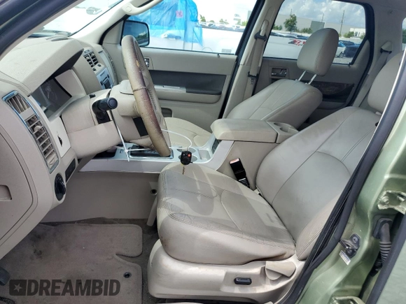 2009 Mercury Mariner Hybrid with VIN 4M2CU29399KJ17064, listed as a Copart auction lot 60263545 with 176,232 mi miles and Salvage title. Bid and sale history available at DreamBid. Image 7.