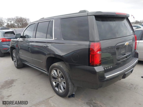 2015 Chevrolet Tahoe LTZ with VIN 1GNSCCKC7FR614886, listed as a IAAI auction lot 41679585 with 104,695 mi miles. Bid and sale history available at carsss.com. Image 3.