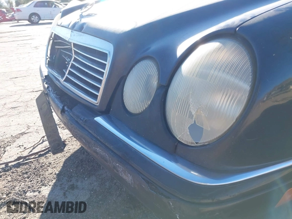 1997 Mercedes-Benz E-Class with VIN WDBJF55F6VJ032691, listed as a IAAI auction lot 40807926 with 215,262 mi miles. Bid and sale history available at carsss.com. Image 12.