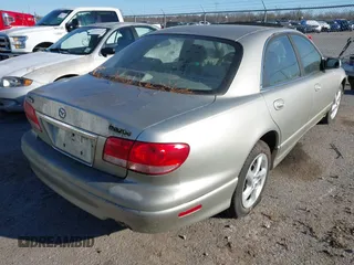 2002 Mazda Millenia z VIN JM1TA221021739118, wystawiony jako IAAI lot #41268546 z przebiegiem 182 463 mil mil oraz . Historia ofert i sprzedaży dostępna na DreamBid. Obrazek 4.