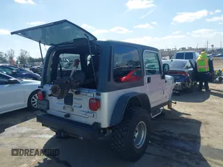 2004 Jeep Wrangler Rubicon with VIN 1J4FA69S94P701660, listed as a IAAI auction lot 41699554 with 74,640 mi miles. Bid and sale history available at carsss.com. Image 4.