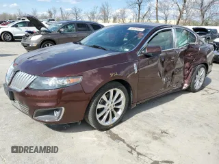 2012 Lincoln MKS EcoBoost with VIN 1LNHL9FT0CG800031, listed as a Copart auction lot 50520885 with 101,080 mi miles and Salvage title. Bid and sale history available at DreamBid. Image 1.