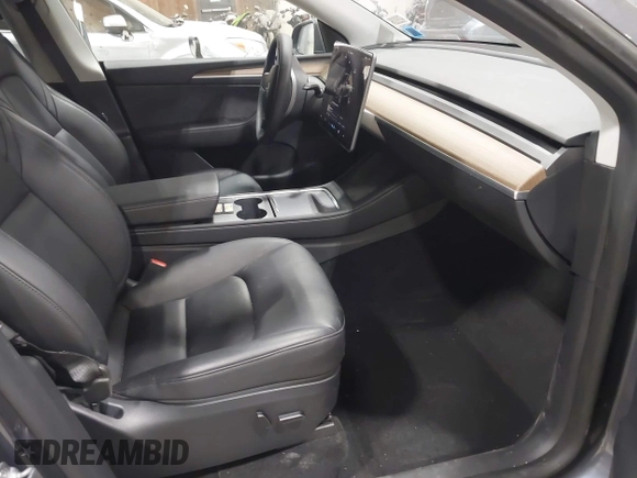 2023 Tesla Model Y Long Range with VIN 7SAYGAEE2PF755674, listed as a IAAI auction lot 41890025 with 24,783 mi miles and . Bid and sale history available at DreamBid. Image 5.