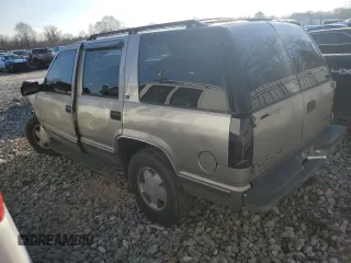 1999 GMC Yukon with VIN 1GKEK13R3XJ785249, listed as a Copart auction lot 42825185 with 351,225 mi miles and Salvage Title. Bid and sale history available at carsss.com. Image 2.