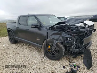 2022 Rivian R1T Adventure z VIN 7FCTGAAA5NN015734, wystawiony jako Copart lot #44019715 z przebiegiem 27 542 mil mil oraz Szkody całkowita. Historia ofert i sprzedaży dostępna na DreamBid. Obrazek 4.
