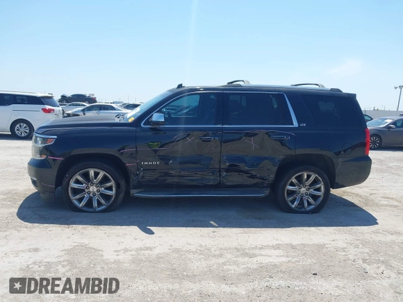 2015 Chevrolet Tahoe LTZ with VIN 1GNSCCKC4FR309152, listed as a IAAI auction lot 42029341 with 187,313 mi miles and . Bid and sale history available at DreamBid. Image 6.