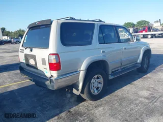 1997 Toyota 4Runner Limited with VIN JT3GN87R3V0043679, listed as a IAAI auction lot 42043029 with 296,834 mi miles. Bid and sale history available at carsss.com. Image 4.