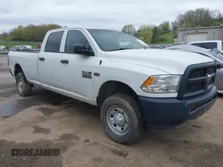 2015 Ram 2500 Tradesman z VIN 3C6TR5HTXFG695405, wystawiony jako IAAI lot #42051190 z przebiegiem 144 503 mil mil oraz . Historia ofert i sprzedaży dostępna na DreamBid. Obrazek 1.