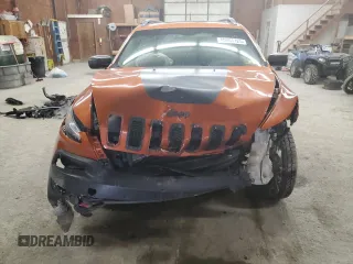 2014 Jeep Cherokee Trailhawk with VIN 1C4PJMBS0EW308775, listed as a Copart auction lot 60465125 with 117,326 mi miles and Salvage title. Bid and sale history available at DreamBid. Image 5.