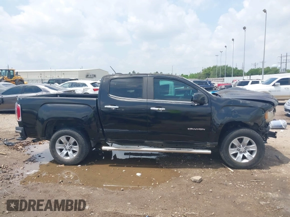 2015 GMC Canyon 2WD SLE with VIN 1GTG5BE3XF1226497, listed as a IAAI auction lot 42106960 with 97,360 mi miles and . Bid and sale history available at DreamBid. Image 14.