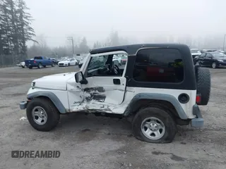 2006 Jeep Wrangler Sport Right Hand Drive with VIN 1J4F449S16P709895, listed as a IAAI auction lot 41349311 with 157,125 mi miles. Bid and sale history available at carsss.com. Image 14.