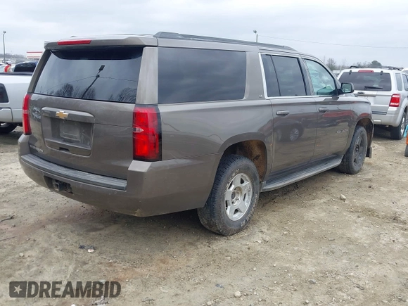 2015 Chevrolet Suburban LT z VIN 1GNSCJKC6FR675585, wystawiony jako IAAI lot #41510570 z przebiegiem 156 818 mil mil oraz . Historia ofert i sprzedaży dostępna na DreamBid. Obrazek 4.