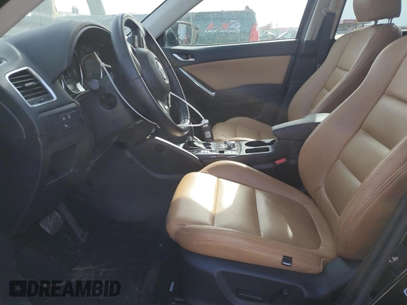 2016 Mazda CX-5 Touring z VIN JM3KE4CY0G0667171, wystawiony jako Copart lot #51579005 z przebiegiem 39 487 mil mil oraz Szkoda całkowita • Salvage title. Historia ofert i sprzedaży dostępna na DreamBid. Obrazek 7.