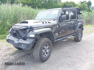 2020 Jeep Wrangler Unlimited Sport S with VIN 1C4HJXDN7LW113735, listed as a IAAI auction lot 42639884 with 48,736 mi miles and . Bid and sale history available at DreamBid. Image 2.