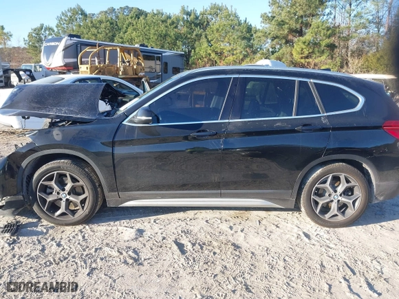 2019 BMW X1 sDrive28i with VIN WBXHU7C52K5L11560, listed as a IAAI auction lot 41354422 with 115,401 mi miles. Bid and sale history available at carsss.com. Image 14.