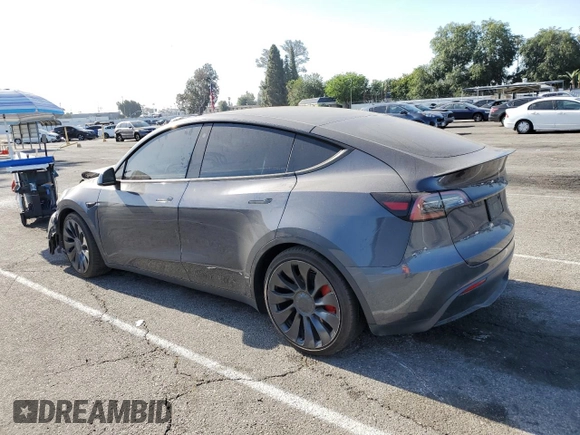 2022 Tesla Model Y Performance z VIN 7SAYGDEF1NF405329, wystawiony jako Copart lot #57249195 z przebiegiem 62 423 mil mil oraz Szkoda całkowita • Salvage title. Historia ofert i sprzedaży dostępna na DreamBid. Obrazek 2.