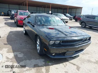 2014 Dodge Challenger SXT with VIN 2C3CDYAG9EH154337, listed as a IAAI auction lot 42100058 with 138,689 mi miles and . Bid and sale history available at DreamBid. Image 1.