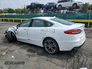 2020 Ford Fusion Titanium z VIN 3FA6P0D96LR205475, wystawiony jako Copart lot #56313075 z przebiegiem 30 888 mil mil oraz Szkoda całkowita • Salvage title. Historia ofert i sprzedaży dostępna na DreamBid. Obrazek 2.