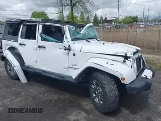 2016 Jeep Wrangler Unlimited Sahara z VIN 1C4BJWEG8GL129577, wystawiony jako IAAI lot #42184373 z przebiegiem 185 761 mil mil oraz . Historia ofert i sprzedaży dostępna na DreamBid. Obrazek 1.