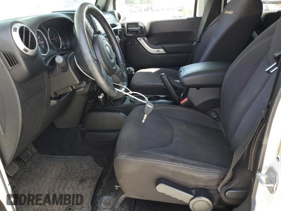 2014 Jeep Wrangler Unlimited Sahara z VIN 1C4BJWEG8EL188271, wystawiony jako Copart lot #59972535 z przebiegiem 130 314 mil mil oraz Szkoda całkowita • Salvage title. Historia ofert i sprzedaży dostępna na DreamBid. Obrazek 7.