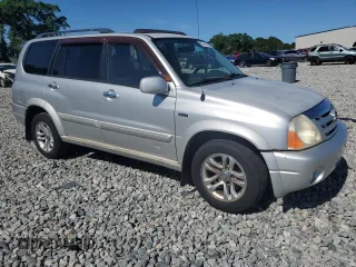 2004 Suzuki XL7 LX z VIN JS3TY92V144105911, wystawiony jako Copart lot #56744425 z przebiegiem 253 975 mil mil oraz Szkoda całkowita • Salvage title. Historia ofert i sprzedaży dostępna na DreamBid. Obrazek 4.