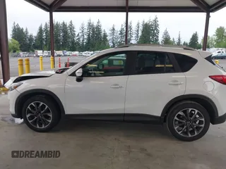 2016 Mazda CX-5 Grand Touring with VIN JM3KE2DYXG0675619, listed as a IAAI auction lot 42137144 with 106,262 mi miles and . Bid and sale history available at DreamBid. Image 14.