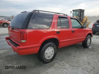 1996 GMC Jimmy SL with VIN 1GKDT13WXT2502347, listed as a Copart auction lot 74502444 with 253,735 mi miles and Salvage Title. Bid and sale history available at carsss.com. Image 3.