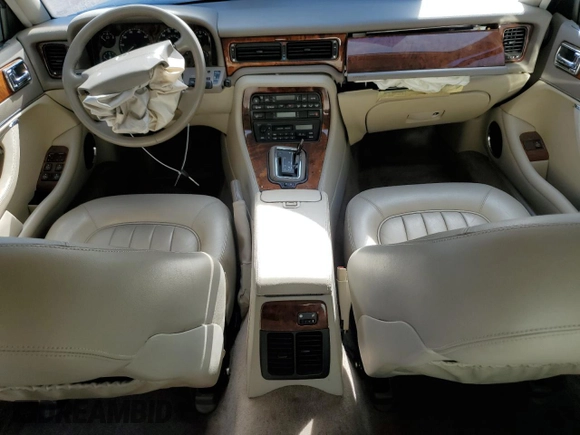 1996 Jaguar XJ with VIN SAJHX1747TC767829, listed as a Copart auction lot 76677444 with Not provided miles and Salvage title. Bid and sale history available at DreamBid. Image 8.