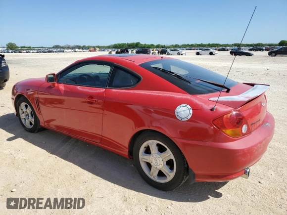 2003 Hyundai Tiburon GT z VIN KMHHN65F53U041351, wystawiony jako Copart lot #52332395 z przebiegiem 194 821 mil mil oraz Czysty tytuł • Clean title. Historia ofert i sprzedaży dostępna na DreamBid. Obrazek 2.
