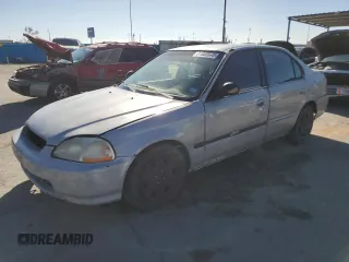 1997 Honda Civic DX with VIN JHMEJ6625VS031009, listed as a Copart auction lot 81850664 with 259,726 mi miles and Salvage Title. Bid and sale history available at carsss.com. Image 1.