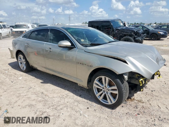 2013 Jaguar XJ Portfolio with VIN SAJWJ2GD5D8V49505, listed as a Copart auction lot 61171955 with 129,158 mi miles and Salvage title. Bid and sale history available at DreamBid. Image 4.