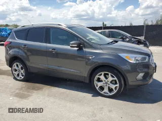 2019 Ford Escape Titanium z VIN 1FMCU9J96KUA65154, wystawiony jako Copart lot #63932325 z przebiegiem 117 963 mil mil oraz Czysty tytuł • Clean title. Historia ofert i sprzedaży dostępna na DreamBid. Obrazek 4.
