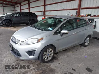 2013 Ford Fiesta SE with VIN 3FADP4BJ3DM173949, listed as a IAAI auction lot 40494276 with 141,061 mi miles. Bid and sale history available at carsss.com. Image 2.