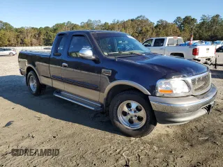 2002 Ford F-150 XL with VIN 1FTRX17L72NA39909, listed as a Copart auction lot 76376994 with 175,926 mi miles and Salvage title. Bid and sale history available at DreamBid. Image 4.