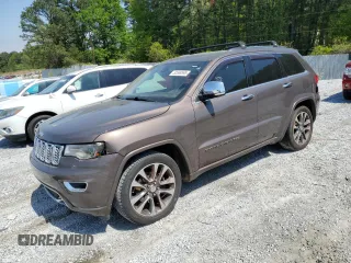 2017 Jeep Grand Cherokee Overland z VIN 1C4RJECG1HC868559, wystawiony jako Copart lot #52569595 z przebiegiem 168 226 mil mil oraz Czysty tytuł • Clean title. Historia ofert i sprzedaży dostępna na DreamBid. Obrazek 1.