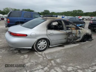 1997 Mercury Sable GS z VIN 1MELM50U4VG609283, wystawiony jako Copart lot #66853354 z przebiegiem Nie podano mil oraz Szkody całkowita. Historia ofert i sprzedaży dostępna na DreamBid. Obrazek 3.